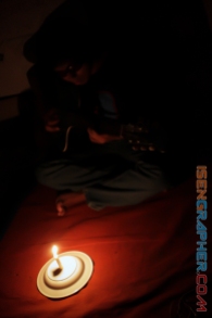photo 2 : a guitar man with candlelight